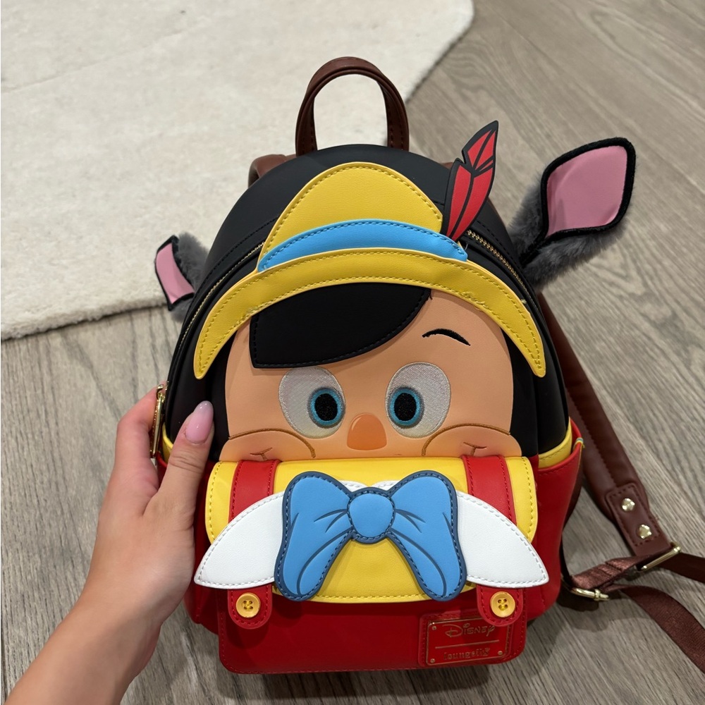 Loungefly Pinocchio Backpack with Red and Yellow Accents
